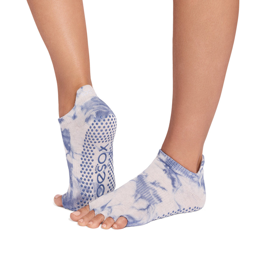 Yoga grip socks with blue and white tie dye design on a white background