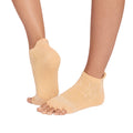 Yellow half toe socks worn by a person on a white background