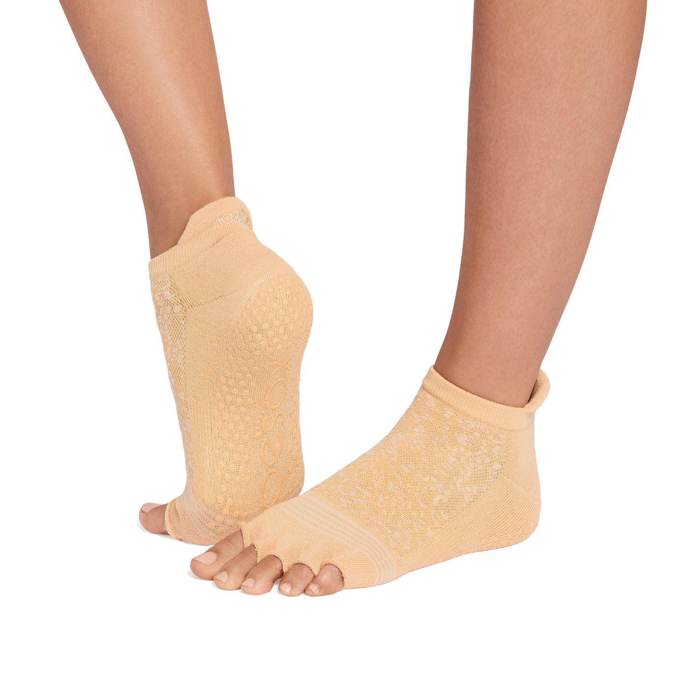 Yellow half toe socks worn by a person on a white background