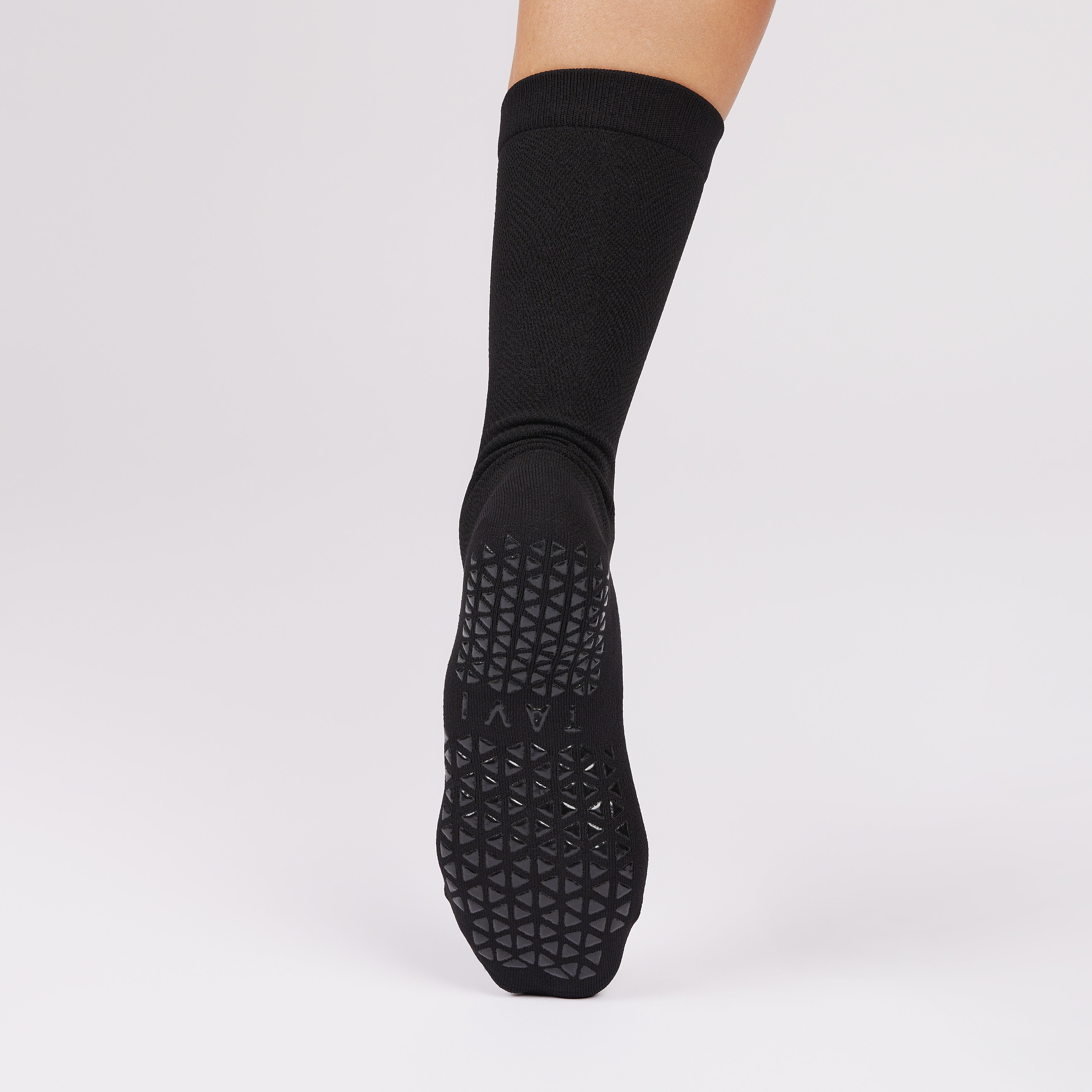 Black non slip sole sock on a white background