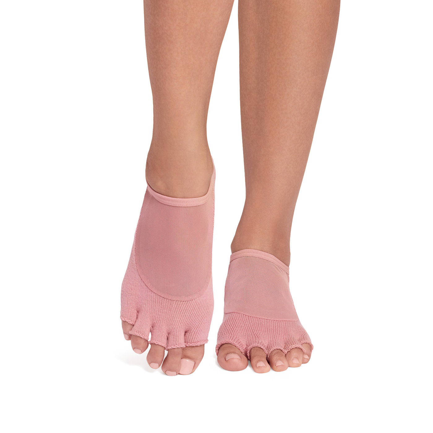Pink toe-separated socks worn by a person on a white background