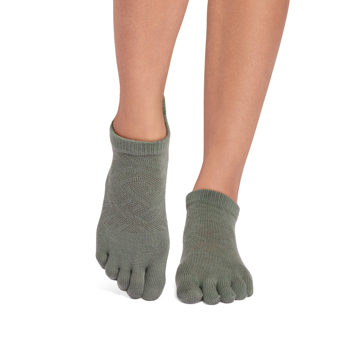 ToeSox Full Toe Low Rise Grip Socks in Ivy field – worn on feet, side view