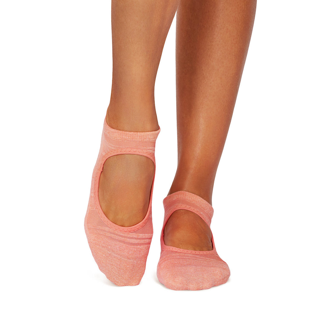Pink ankle socks worn by a person on a white background