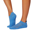 Blue socks with non slip sole and striped design on a white background