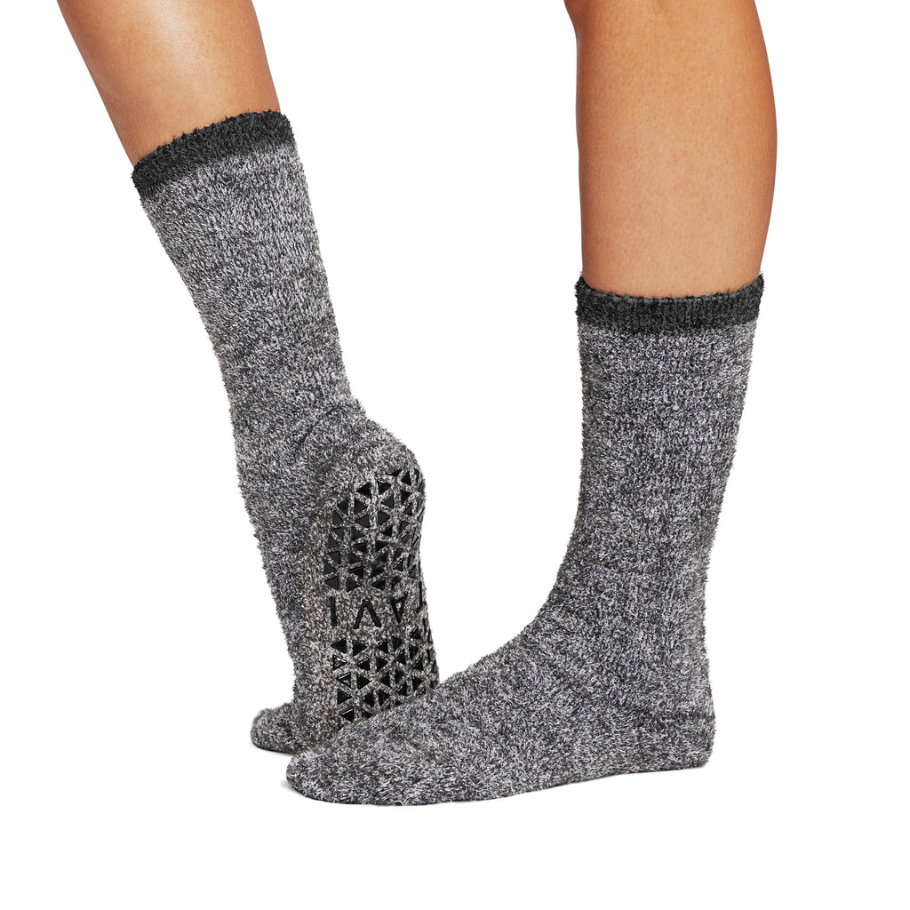 Gray socks with textured pattern on a white background