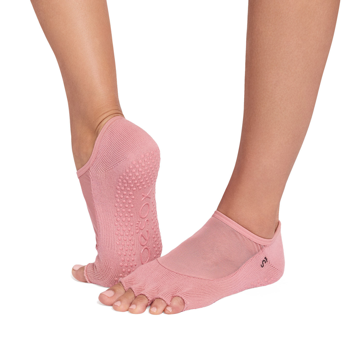 Pink yoga socks with non-slip sole on a white background
