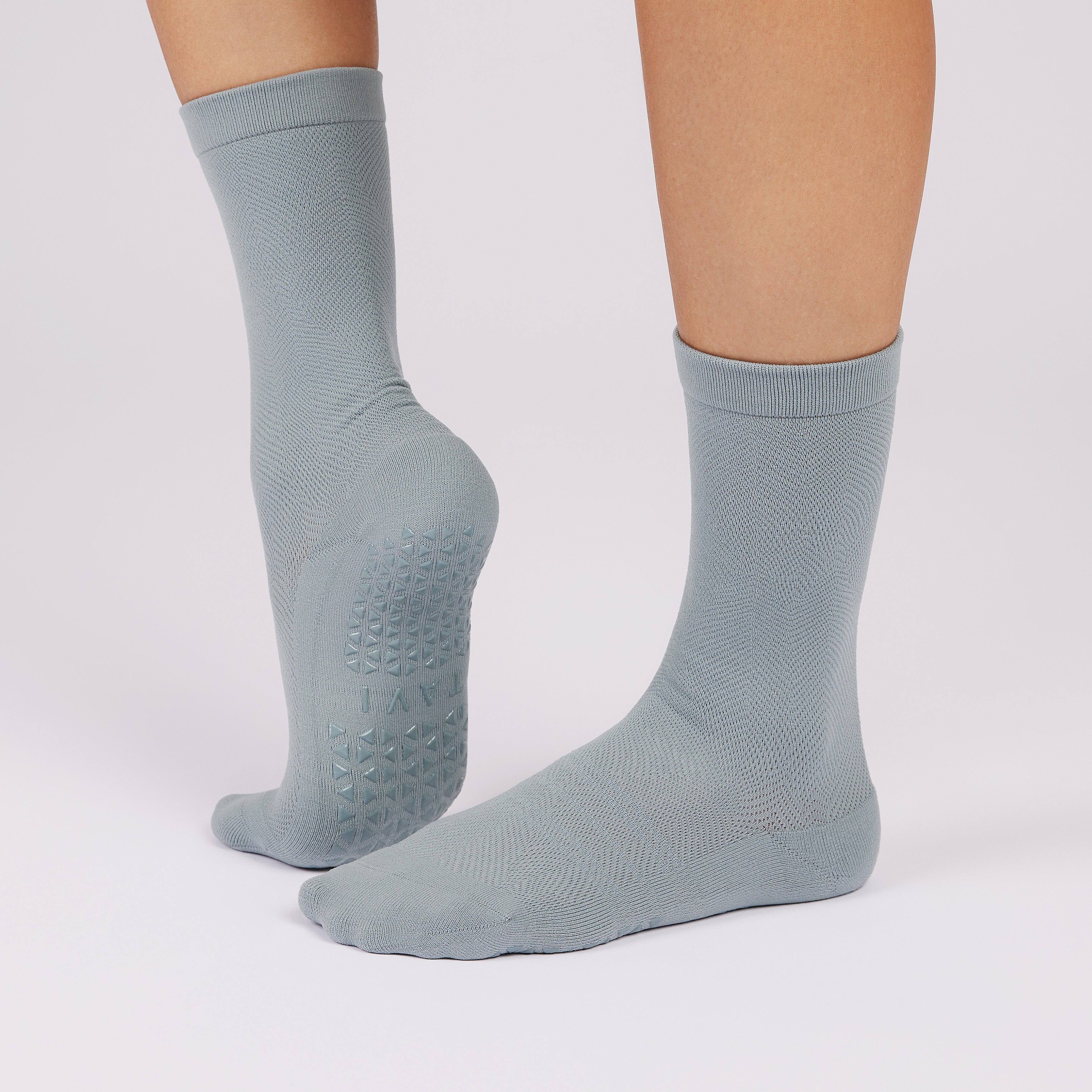 Inner and outer grip lock socks on foot