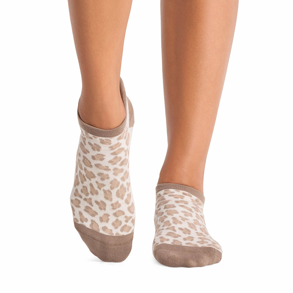 Tavi Grip Savvy Socks in Leopard sand – worn on feet, front view