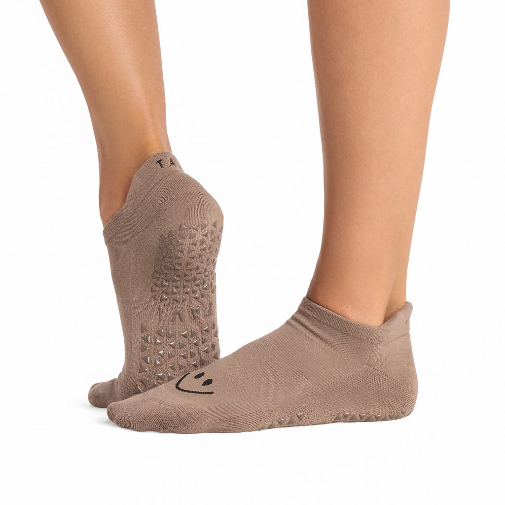 Tavi Grip Savvy Socks in Pebble – worn on feet, side view