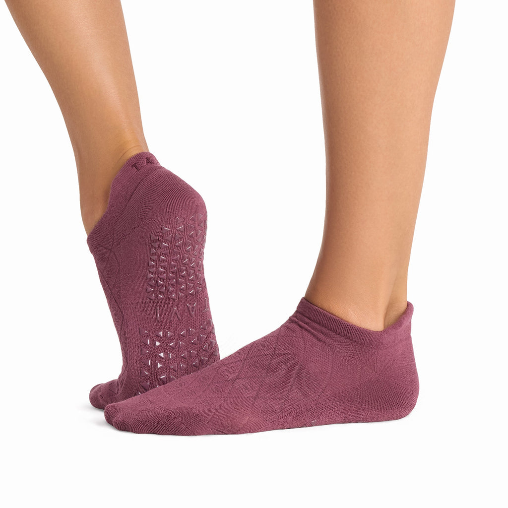 Tavi Grip Savvy Socks in Bordeaux – worn on feet, side view