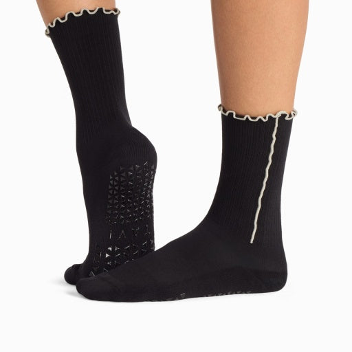 Tavi Grip Kalea Socks in Ebony – worn on feet, side view