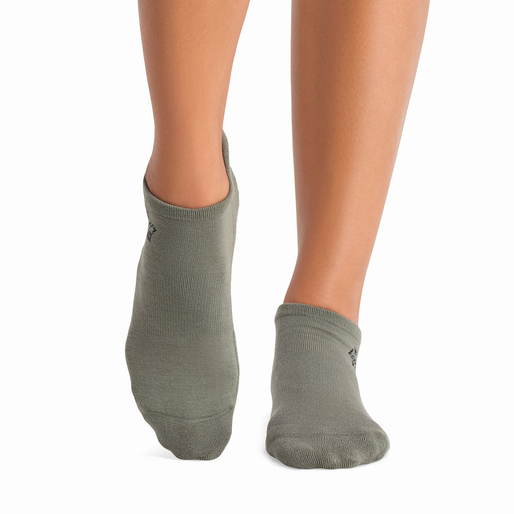 Tavi Grip Savvy Socks in Happy place leaf – worn on feet, front view