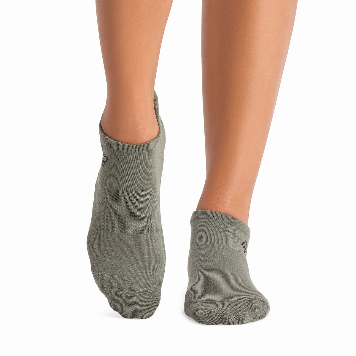 Tavi Grip Savvy Socks in Happy place leaf – worn on feet, front view