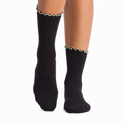 Tavi Grip Kalea Socks in Ebony – worn on feet, front view