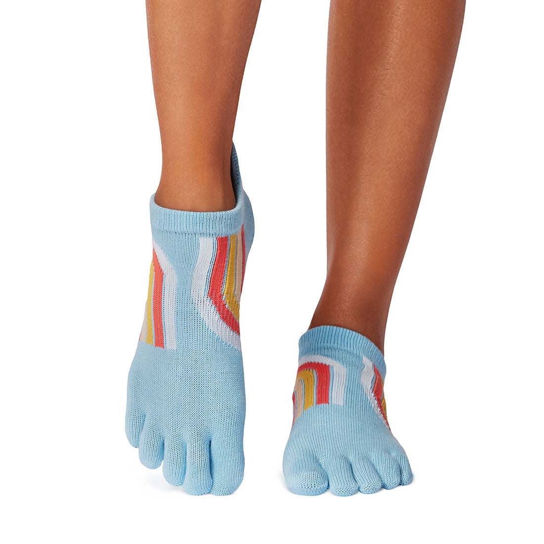 Blue toe socks with colorful stripes worn by a person on a white background